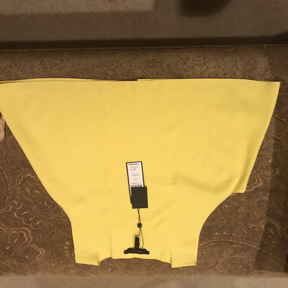 Yellow top, with slit in the back